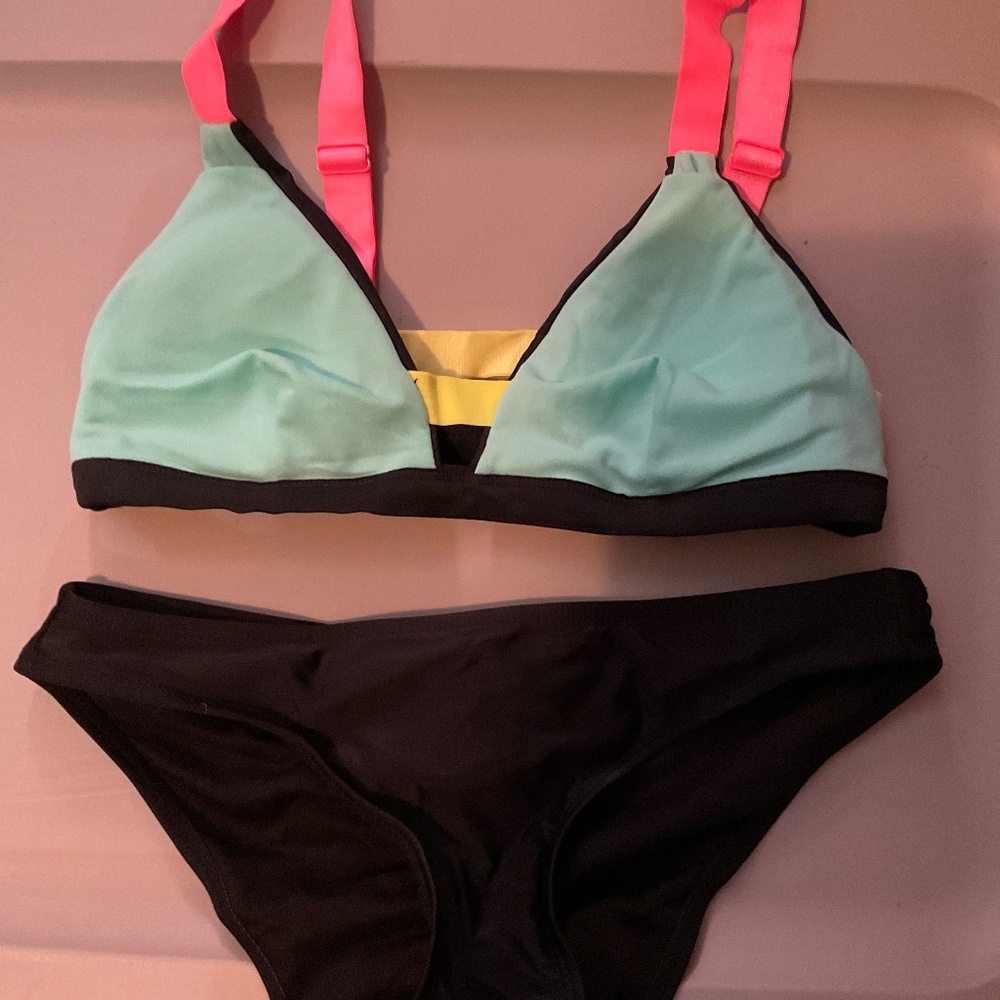 Bikini small bright multi colored top with black bottoms. W20